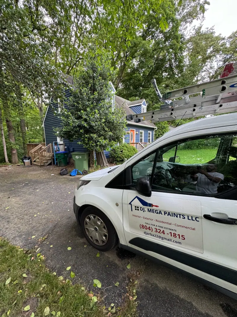 DJ Mega Paints work van parked at a Richmond home