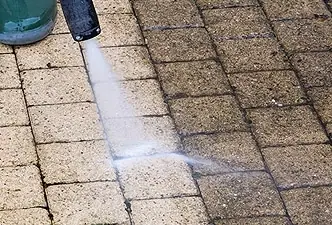 Power washing a paver surface